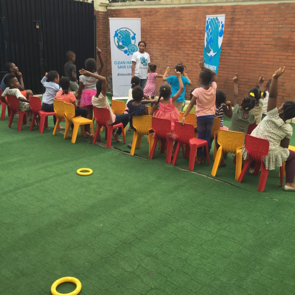 Speaking to the children and asking them about handwashing