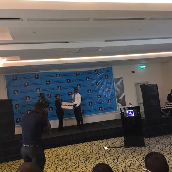 DRASA's Managing Director Niniola Soleye awarding the Dr. Ameyo Stella Adadevoh Prize for the Best Grade in Biology to Ikechukwu Augustine Enemoh